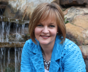 head shot blue jacket & waterfall up close