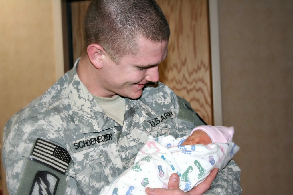 Army Soldier Holds Baby for the first time